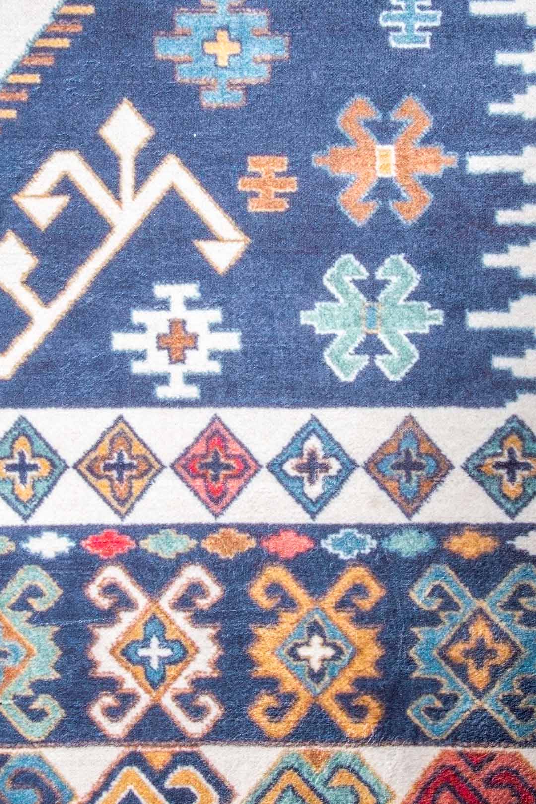 Caucasian-Style Rug – Dark Blue Base with Geometric Patterns